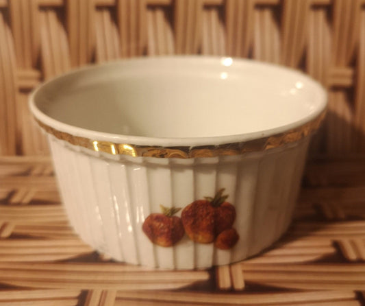 J Chomete & son Pilivite ramekin with gold rim which is worn