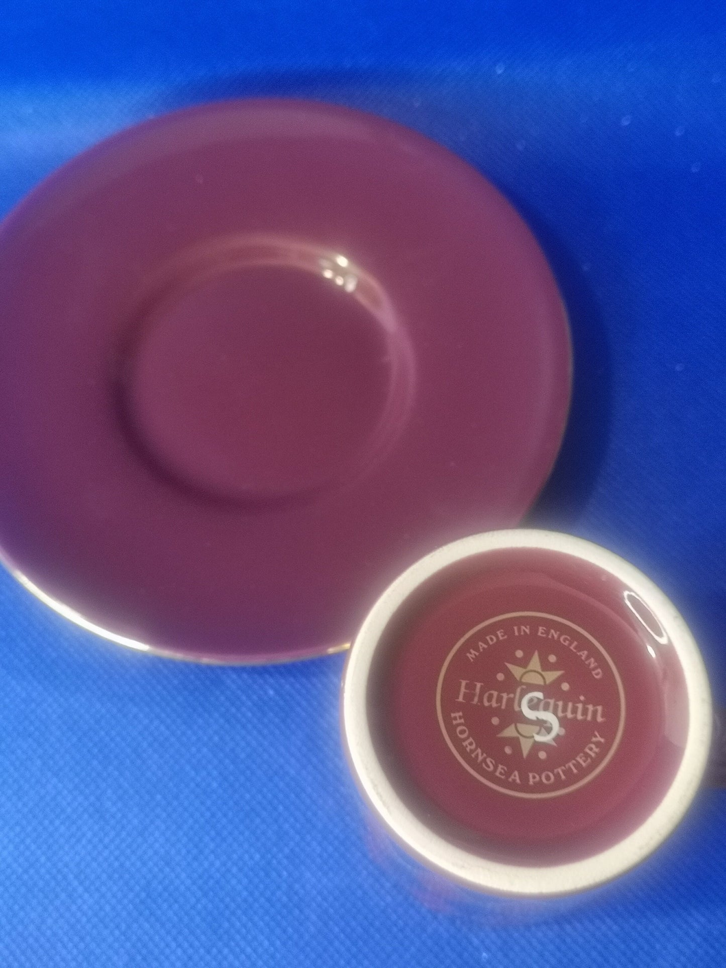 Hornsea pottery burgundy and blue harlequin demitasse cup and saucer