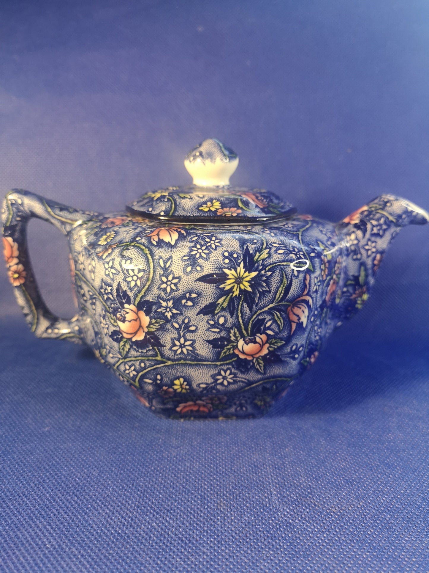 Ringtons teapot by James Sadler Blue with pink flowers