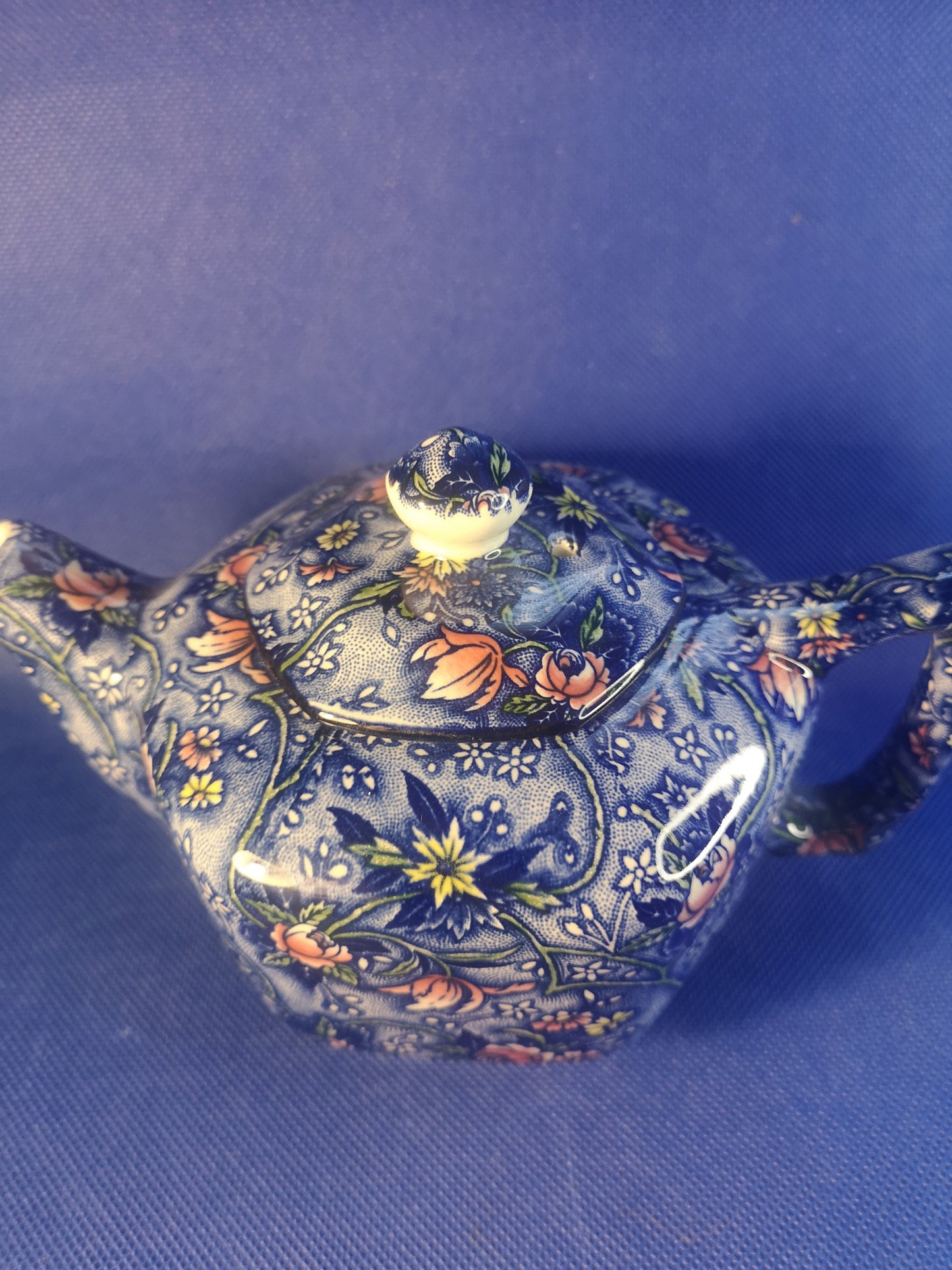 Ringtons teapot by James Sadler Blue with pink flowers