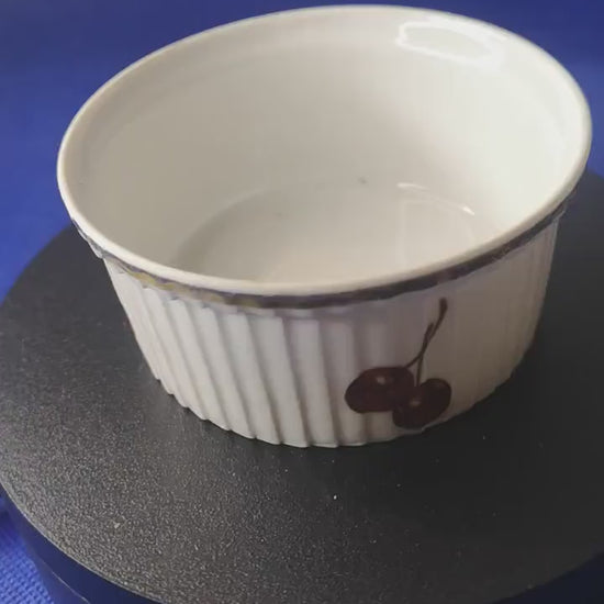 J Chomete & son Pilivite ramekin with gold rim which is worn