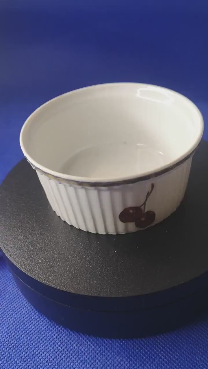 J Chomete & son Pilivite ramekin with gold rim which is worn